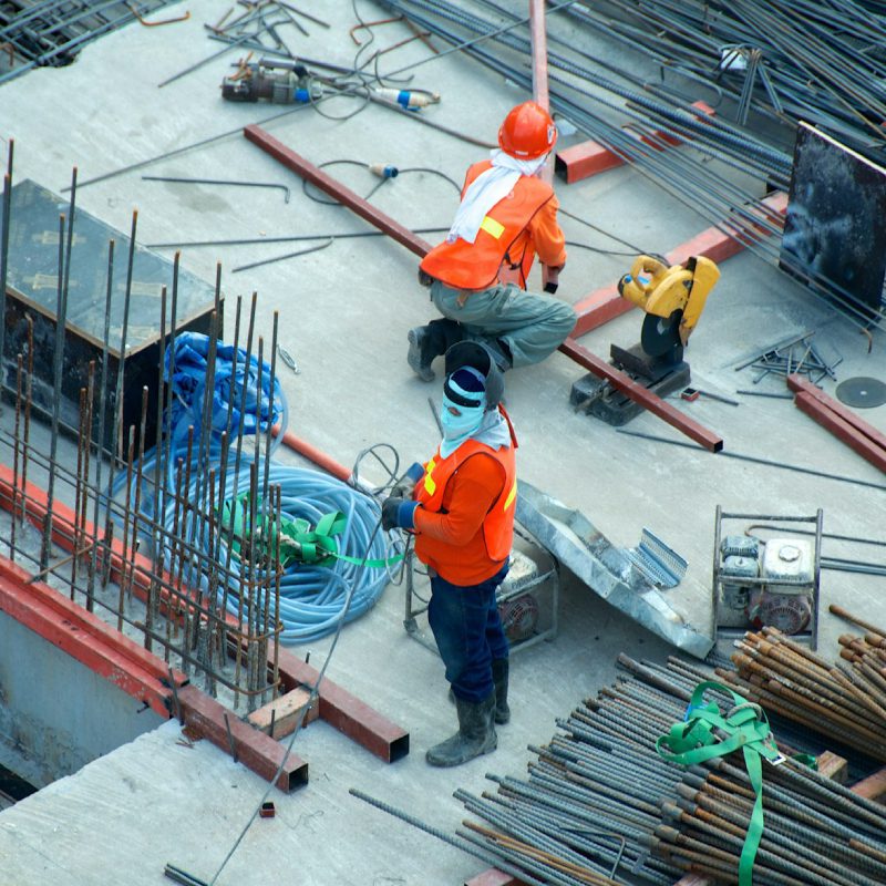 Steel rods being set by workers